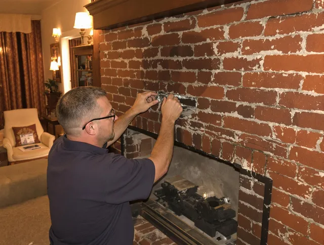 Sudbury Chimney Sweep expert fixing a fireplace in Sudbury, MA